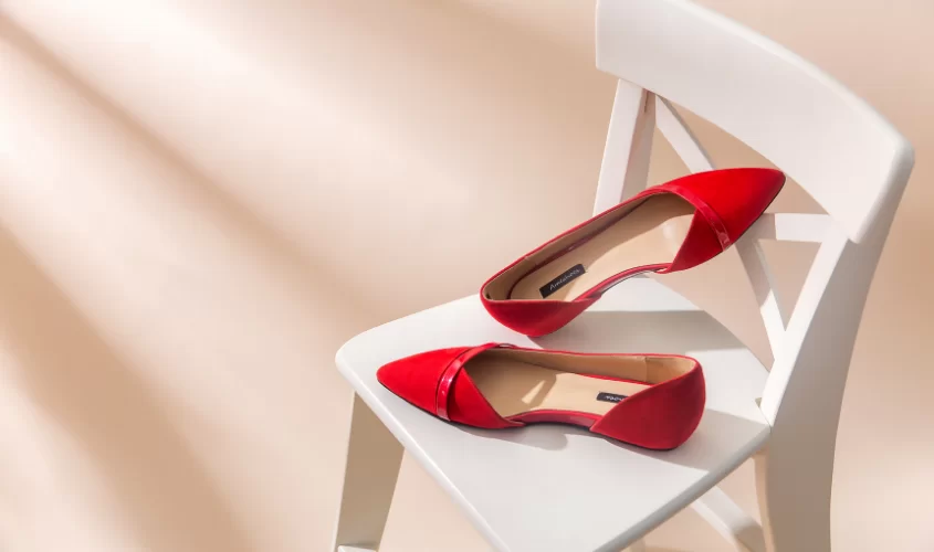 Red Shoes on white chair 
