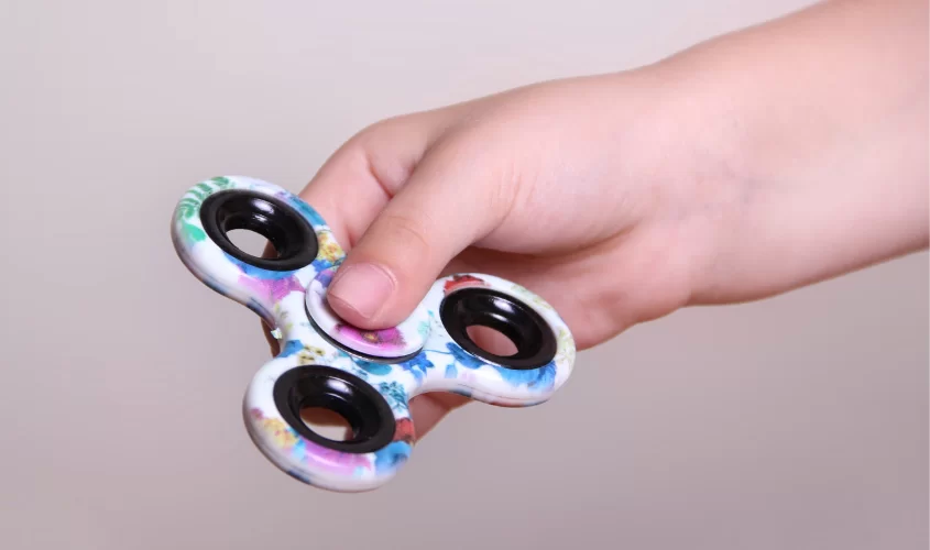Person holding fidget spinner