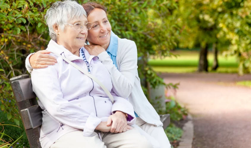 Younger lady hugging older lady