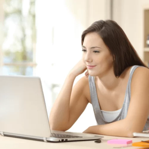 Women looking at open laptop, symbolizing online counselling