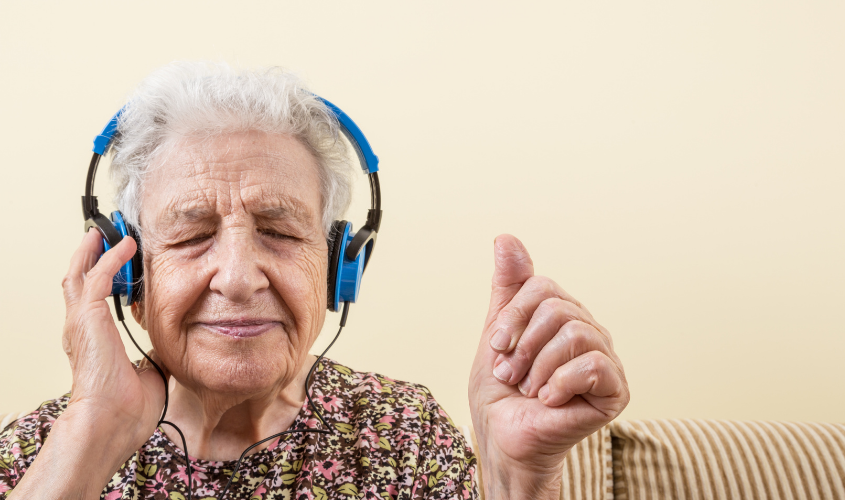 Older woman listening to music