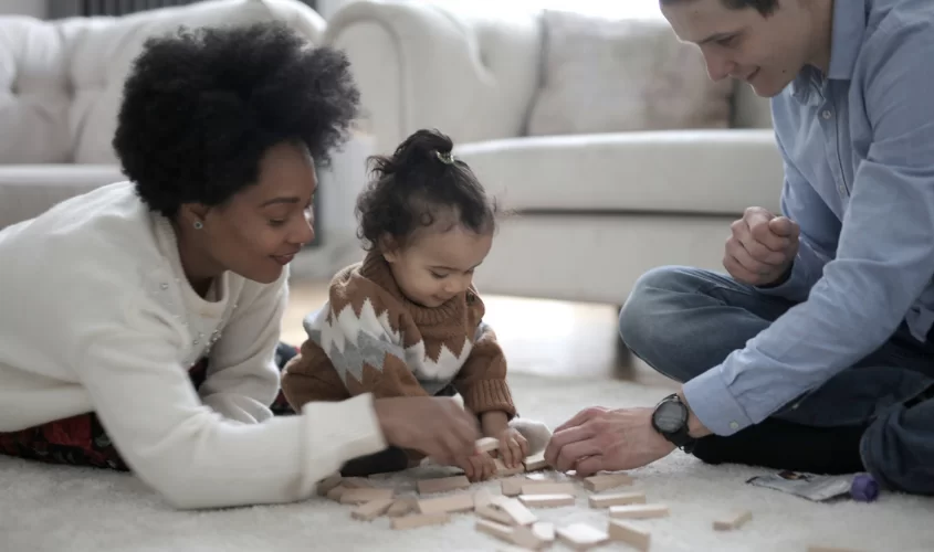 Parents playing with daughter