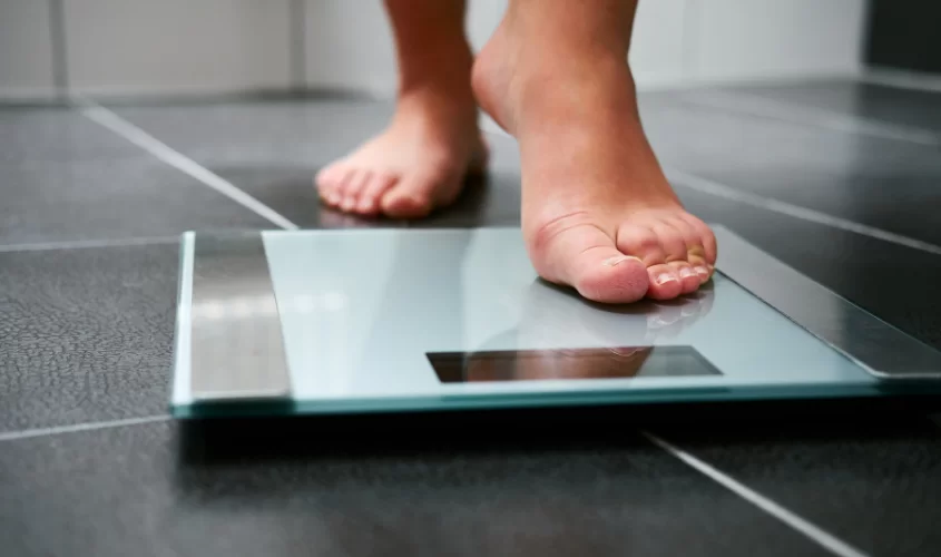 Person stepping on the scale