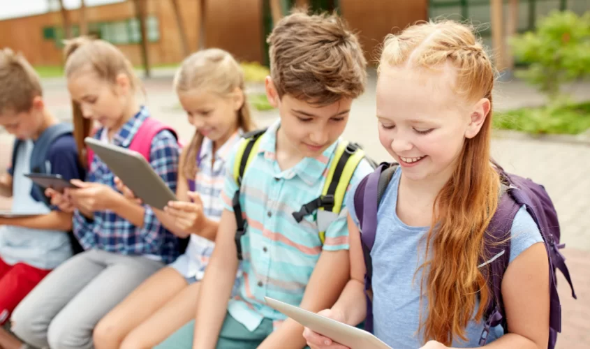 Youth at school on tablets