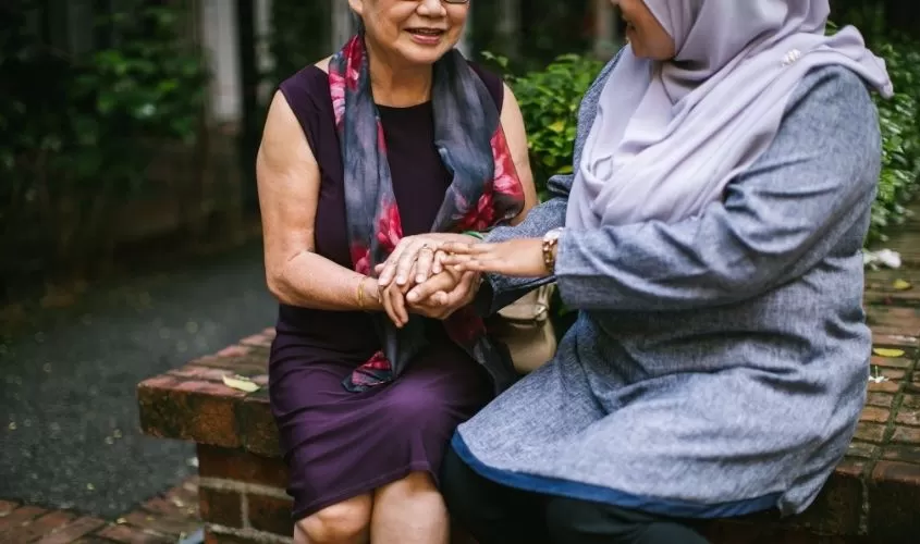 Women holding hands