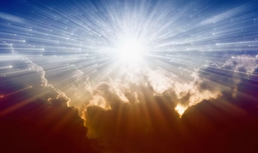 Sun illuminating the sky, shining through the clouds