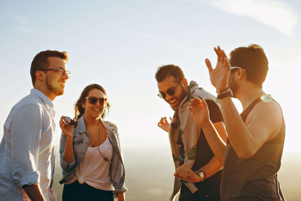 group of young people at sunset