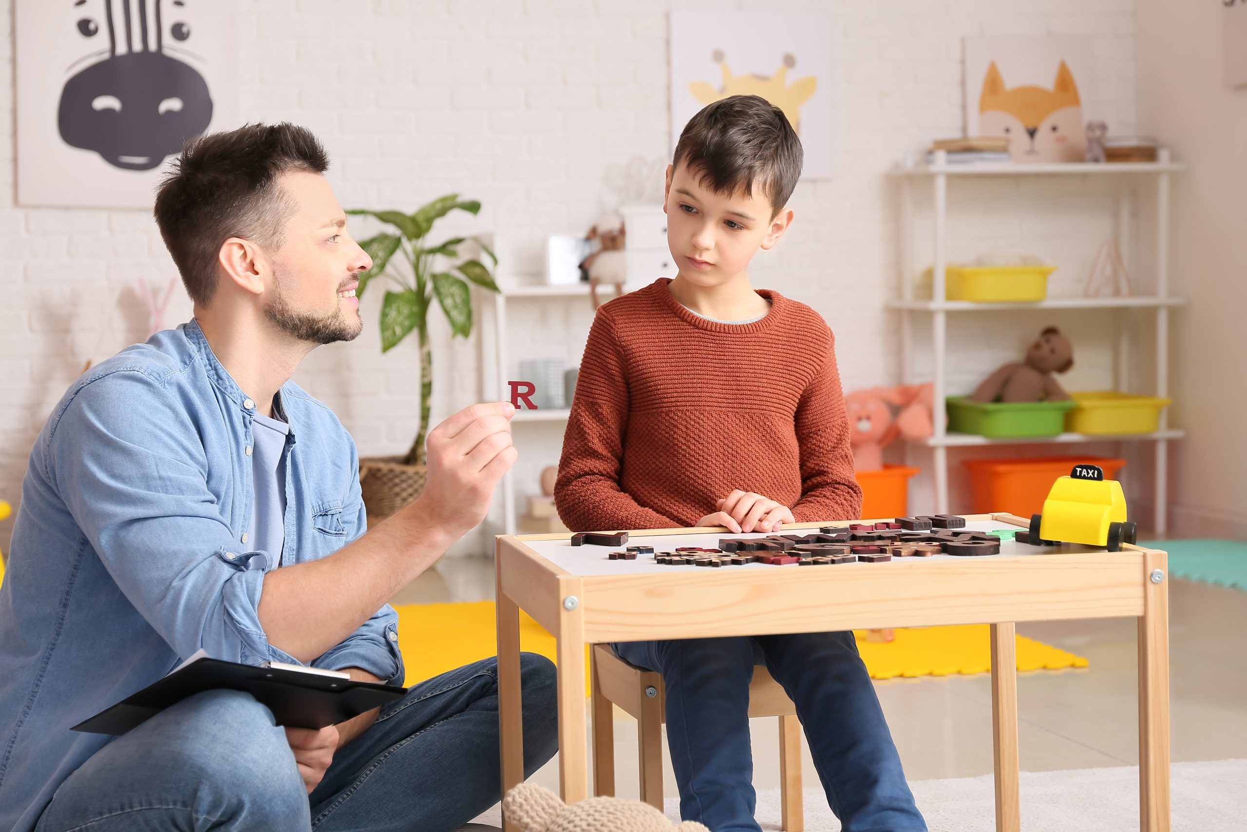 Male Therapist Working with a young patient