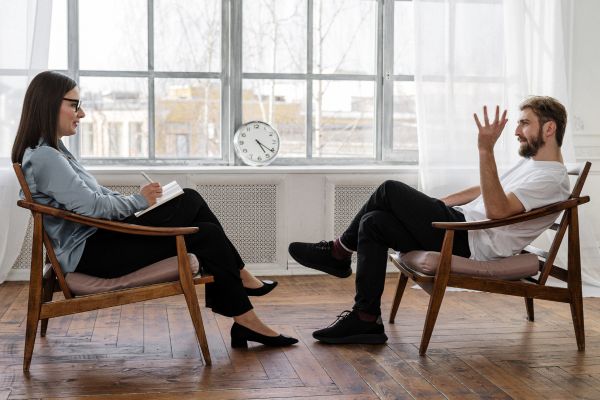 Counselling Session between a female therapist and male client