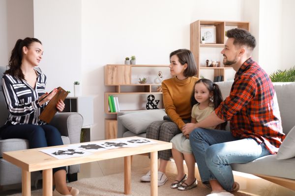 Family speaking to a counsellor