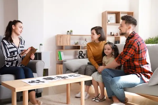 Family speaking to a counsellor