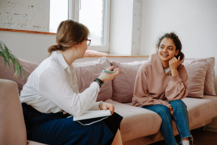 Psychologist counselling session on a Pink Couch