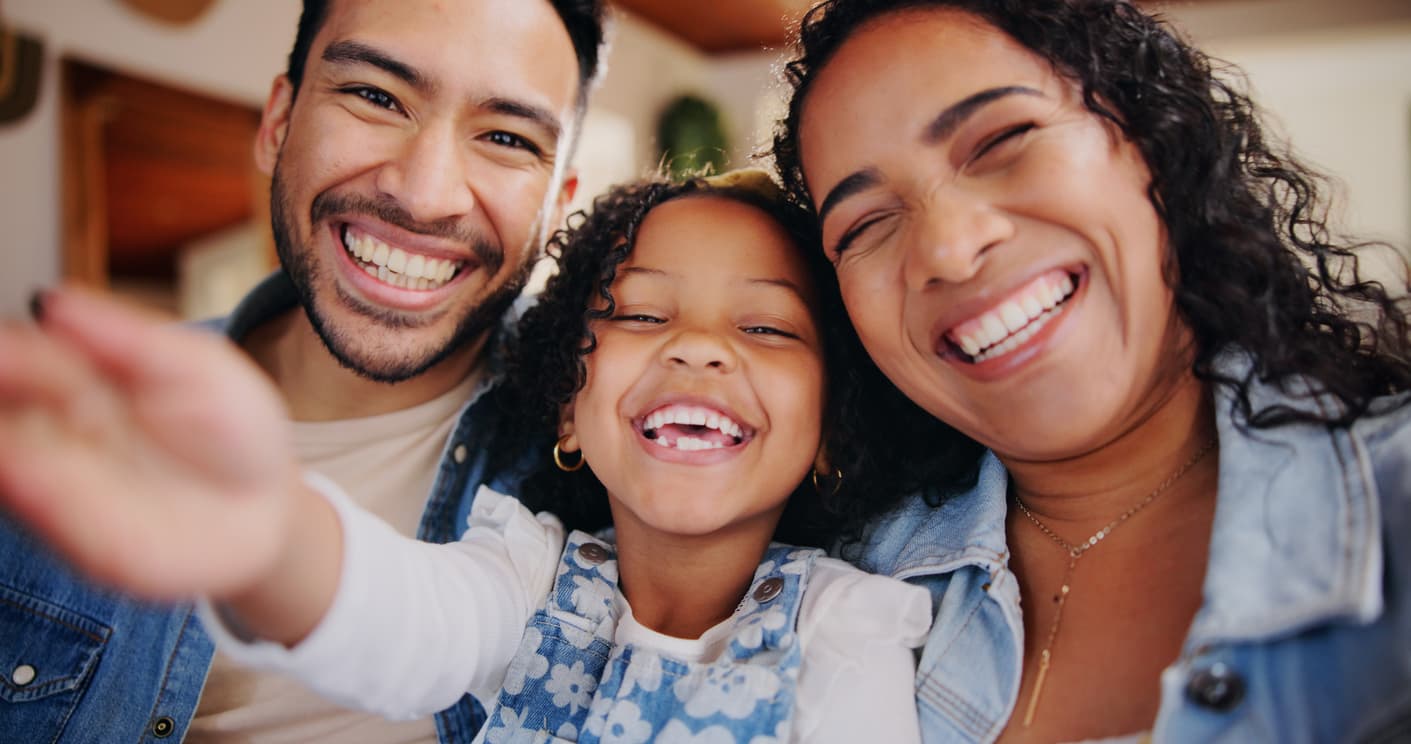 Happy family taking a selfie near the Edmonton South counselling location